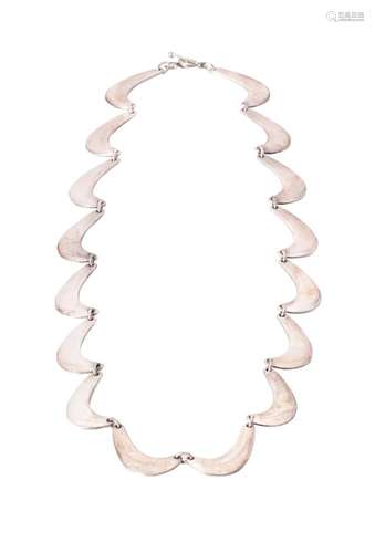 A silver coloured necklace designed by Nanna Ditzel for Geor...