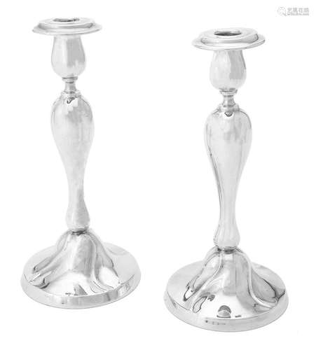 A pair of German silver coloured candlesticks