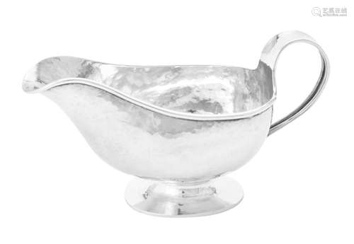 A silver oval sauce boat by A. E. Jones