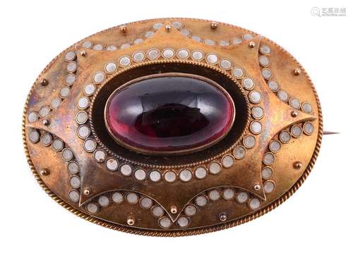 A mid Victorian garnet and enamel oval brooch