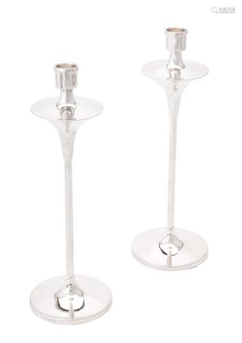 A pair of silver candlesticks by W. I. Broadway & Co.