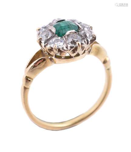 An emerald and diamond cluster ring