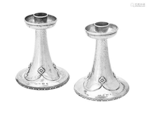 A pair of Arts & Crafts silver candlesticks by Albert Edward...