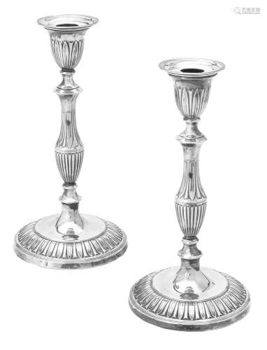 A pair of silver candlesticks by Goldsmiths & Silversmiths C...