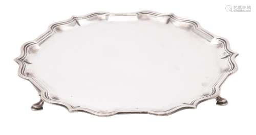 A silver shaped circular salver by Harrods Ltd.