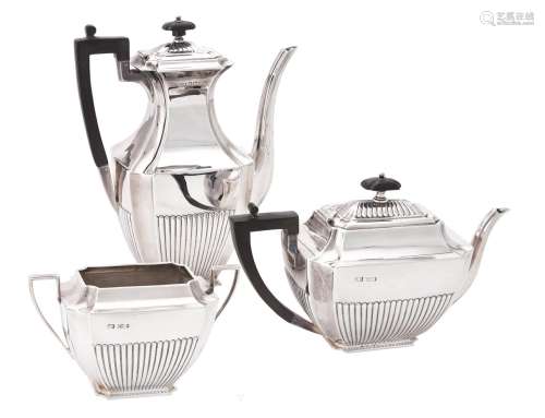 A late Victorian silver three piece half gadrooned tea and c...
