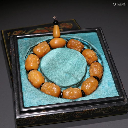 A SHOUSHAN STONE 'ARHATS' HEADS' PRAYER'S BRACELET