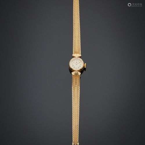 LIP BRACELET MONTRE ronde de dame en or jaune (750), attache...