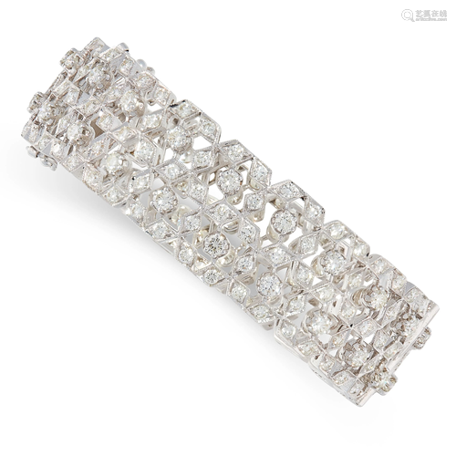 A DIAMOND BANGLE / BRACELET in 18ct white gold, the