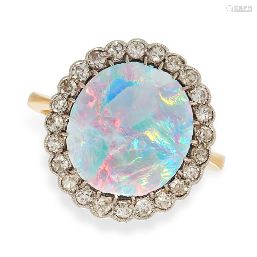 AN OPAL AND DIAMOND RING in yellow gold, set with an