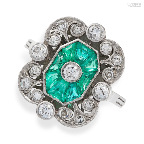 AN EMERALD AND DIAMOND RING in platinum, set with an