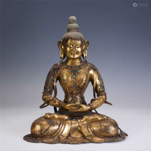 A CHINESE QING STYLE GILT BRONZE FIGURE OF BUDDHA SEATED STA...