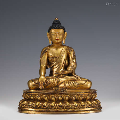 A CHINESE GILT BRONZE FIGURE OF BUDDHA SEATED STATUE