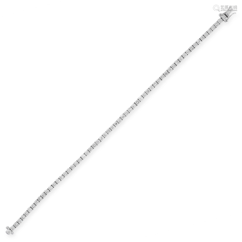 A DIAMOND LINE BRACELET in 18ct white goldd, comprising