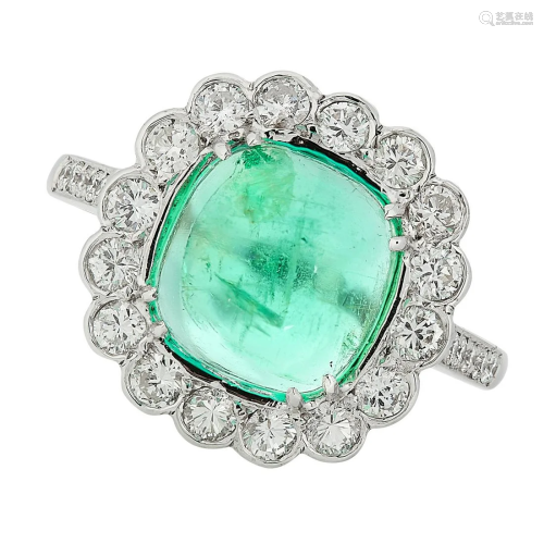 AN EMERALD AND DIAMOND RING in 18ct white gold, set