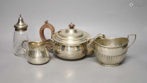 A George V silver teapot, Birmingham, 1913, a similar cream ...