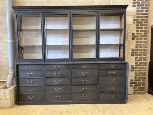 A Victorian painted pine glazed cabinet fitted twenty drawer...