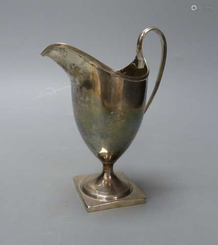 A George III silver helmet shaped cream jug, I.B, London, 18...