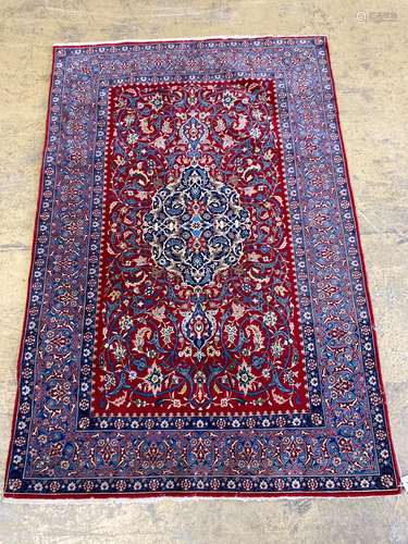 An Isfahan red ground rug, 169 x 110cm