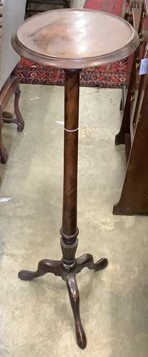 A mahogany torchere, height 122cm