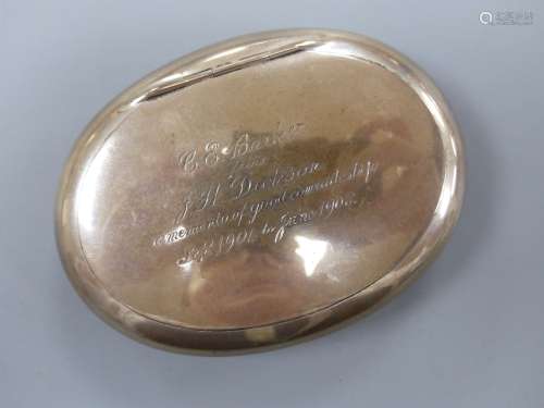 An Edwardian silver oval tobacco box, with engraved inscript...