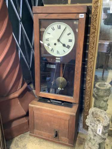 An early 20th century oak cased clocking in clock, height 11...