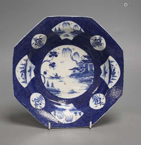 A Bow octagonal plate, painted with landscapes on a blue gro...