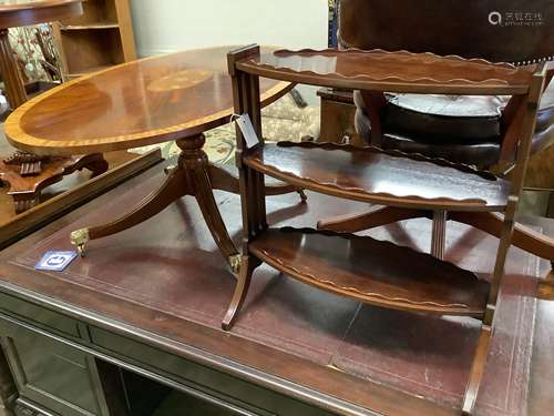 A reproduction low oval mahogany coffee table, length 120cm,...