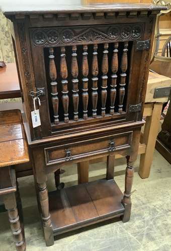 A 17th century style oak dole cupboard or food hutch,the doo...