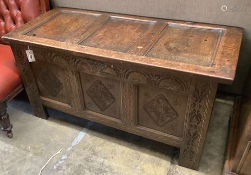 A 17th / 18th century panelled carved oak coffer, length 122...