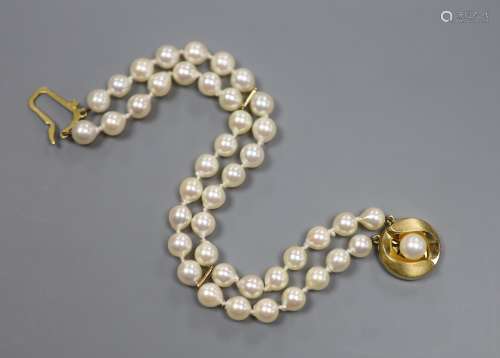 A modern double strand cultured pearl bracelet with a 9ct an...