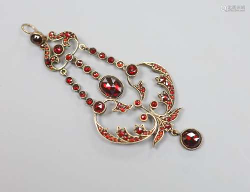 A late Victorian gold plated and facet garnet garnet cluster...