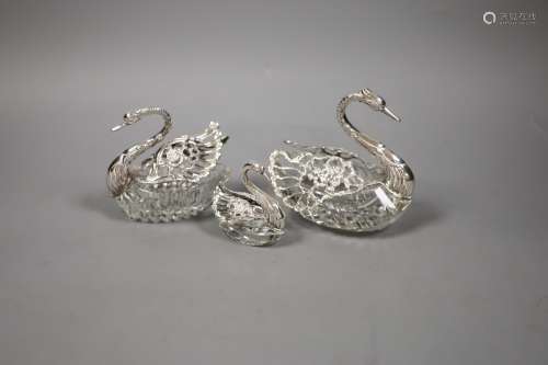 A set of three graduated silver-mounted cut glass 'swan' bon...