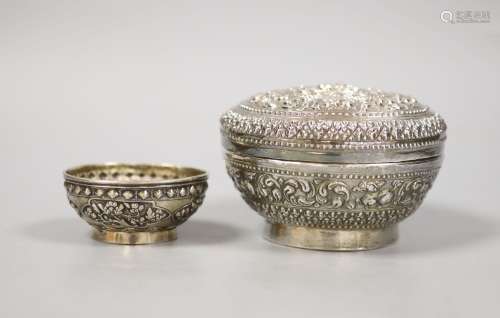 An Indonesian embossed white metal bowl and cover and two si...