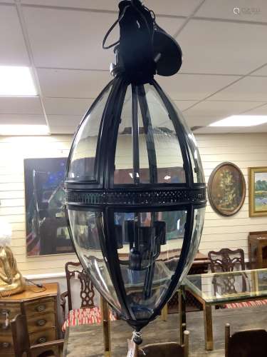 A contemporary black metal and glass hall lantern, height ap...