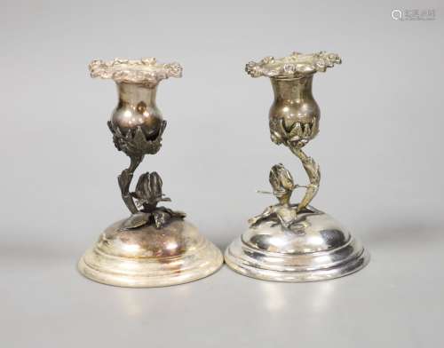 A pair of continental 830 white metal dwarf candlesticks, wi...