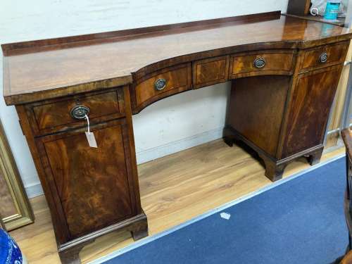 A George IV ebony banded concave front mahogany sideboard, l...