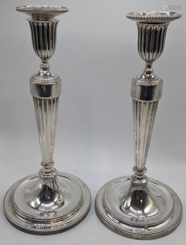 Two George III silver candlesticks, squirrel crests,