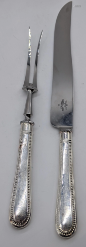 A Mappin & Webb silver handled carving knife, L.36.5cm,