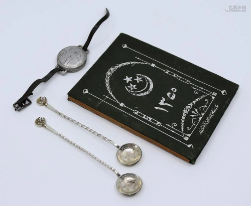 A pair of Islamic silver coin spoons together with a