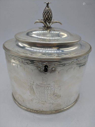 A George III silver tea caddy, crest to the front,