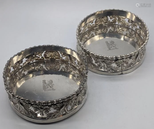 A pair of George III silver coasters, pierced acanthus