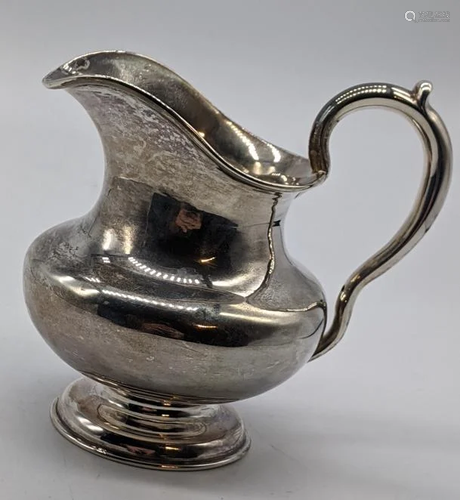 A 19th century Russian silver cream jug, 130g, H.10cm