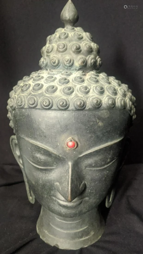 A bronze Buddha head, H.39cm