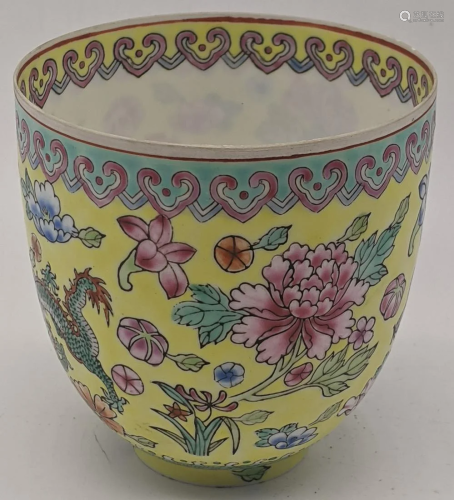 A Chinese Imperial yellow ground eggshell tea cup