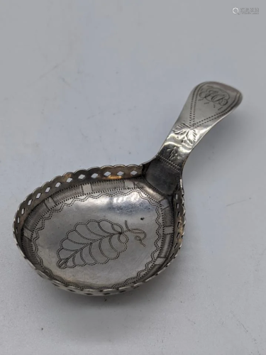 A George III silver caddy spoon, etched leaf