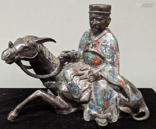 A 19th Japanese enamelled bronze of a horseback rider