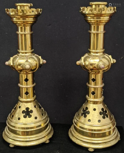 A pair of Gothic Revival brass candlesticks, mounted
