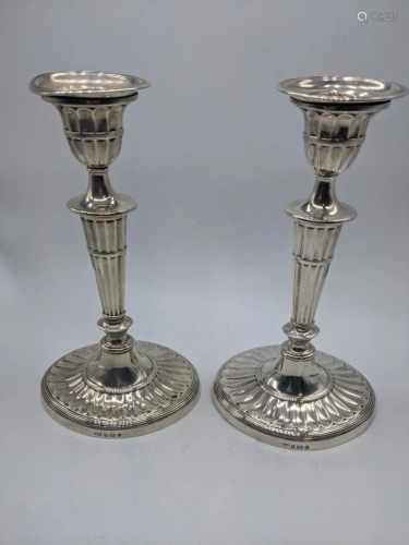 A pair of George III silver candlesticks, hallmarked