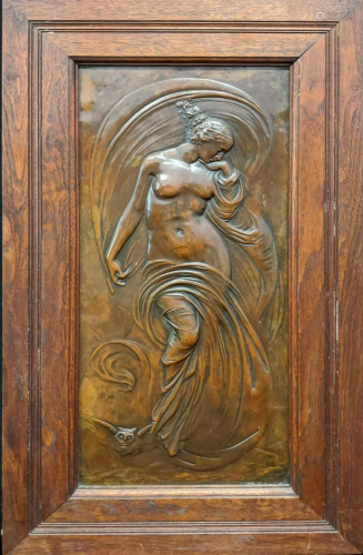 An Art Nouveau copper panel embossed with a maiden and